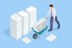 businessman with files in wheelbarrow