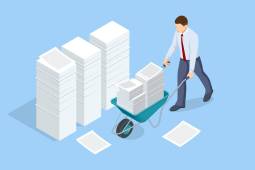 businessman with files in wheelbarrow